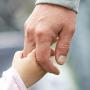 child-parent-holding-hands-closeup-41389858